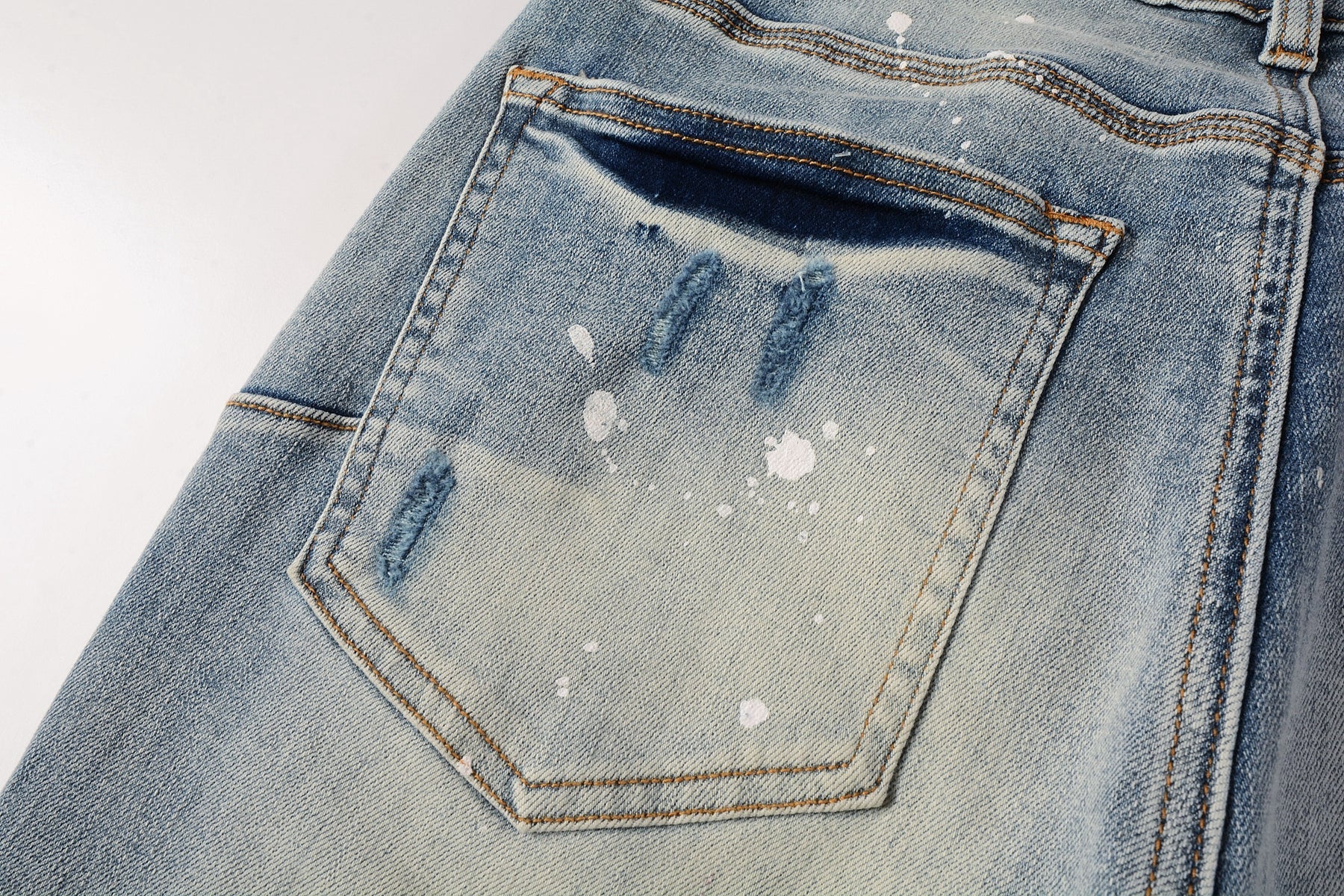 Men Streetwear Skinny Jeans Light Blue Wash with Heavy Distressed Rips and White Paint Splatter 9003