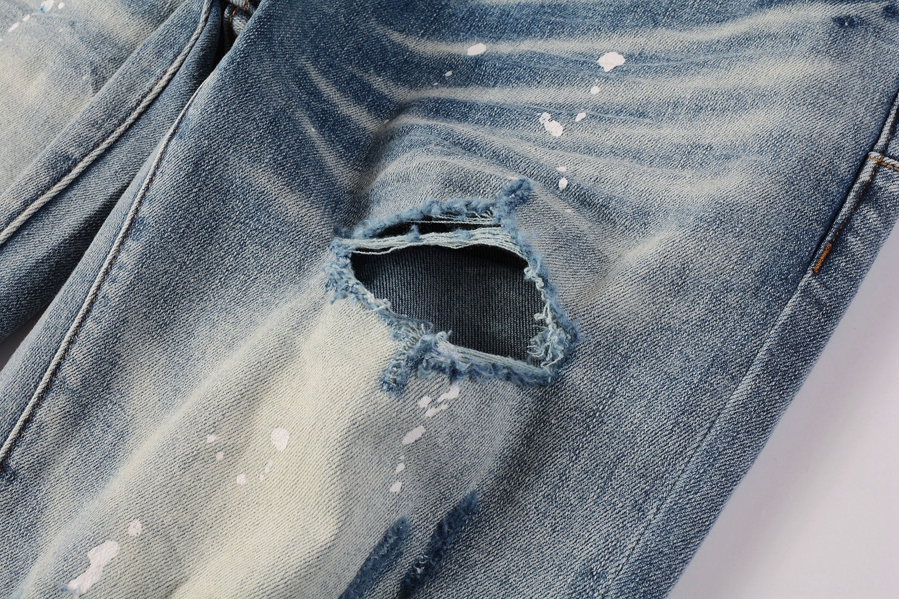Men Streetwear Skinny Jeans Light Blue Wash with Heavy Distressed Rips and White Paint Splatter 9003