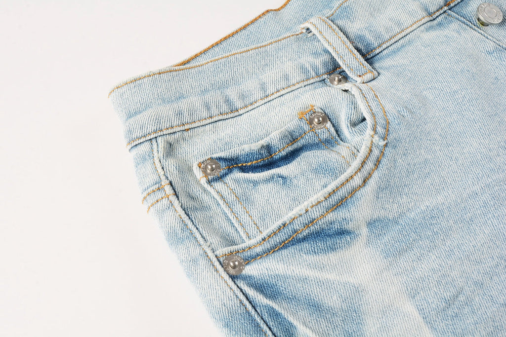 Men Streetwear Denim Shorts Light Blue Wash with White Distressed Patches and Raw Hem 5069