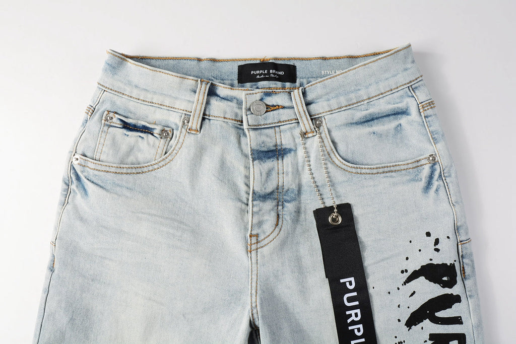 Men Streetwear Denim Shorts Light Blue Wash with Black Paint Streak Print and Raw Hem 5048