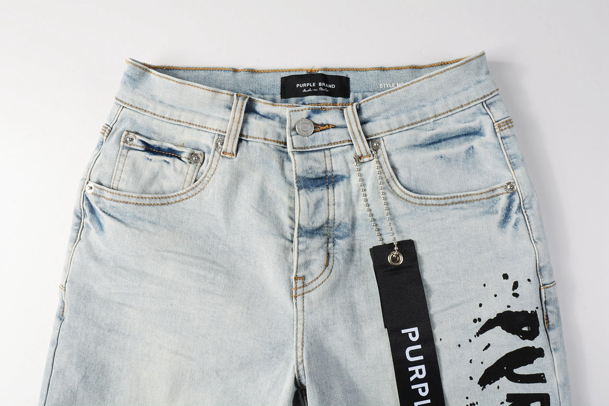 Men Streetwear Denim Shorts Light Blue Wash with Black Paint Streak Print and Raw Hem 5048