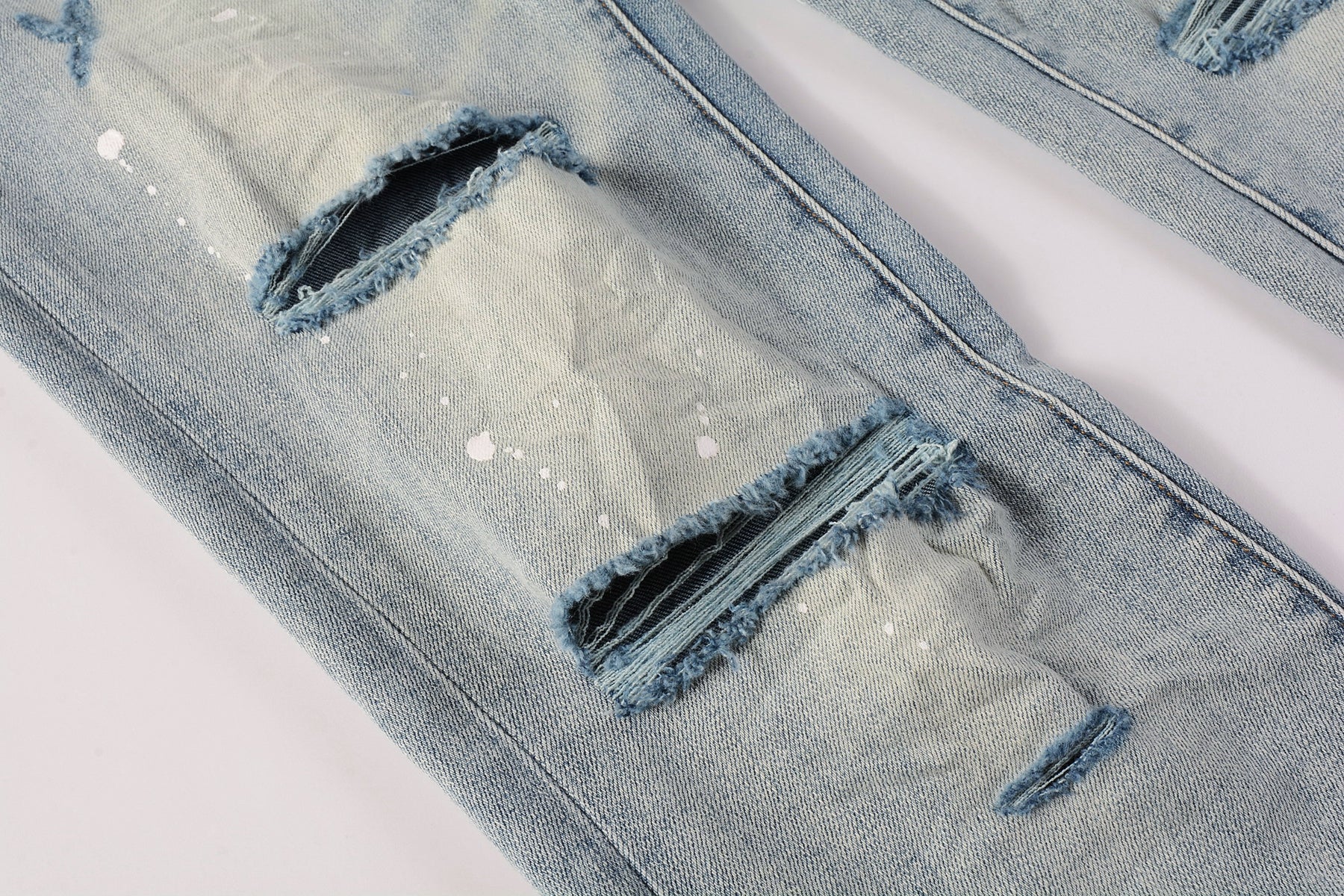 Men Streetwear Skinny Jeans Light Blue Wash with Heavy Distressed Rips and White Paint Splatter 9003