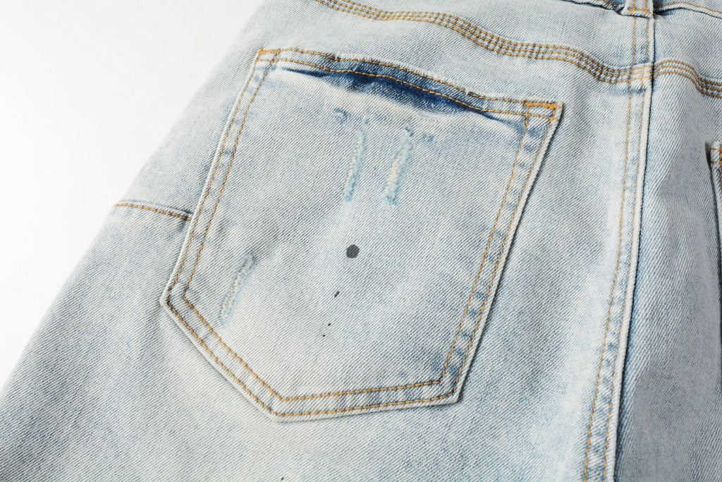 Men Streetwear Denim Shorts Light Blue Wash with White Paint Splatters and Distressed Raw Hem 5006